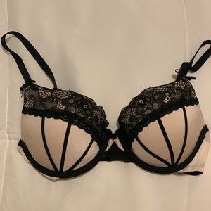 Pink and black lacy bra